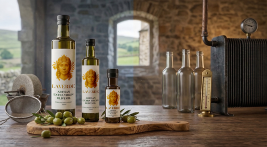 Cold-pressed Sicilian EVOO bottle next to heat-extracted commercial olive oil — UK buyer's comparison of extraction methods and what's worth buying