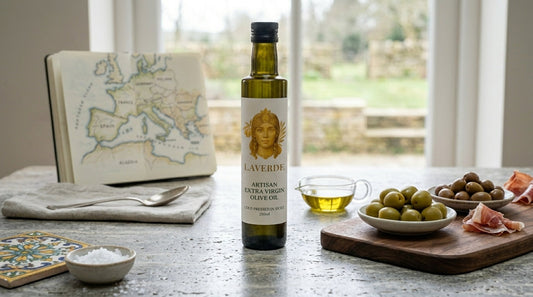 Sicilian Biancolilla and Spanish Picual extra virgin olive oil bottles compared side by side — Mediterranean EVOO origins guide for UK buyers 2026
