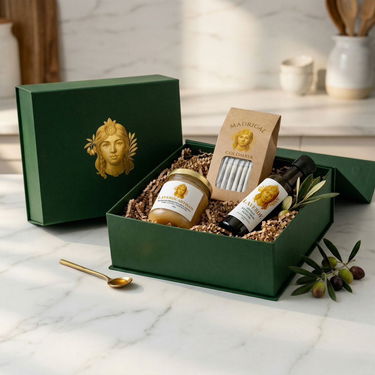 LAVERDE Welcome Pack opened — 100ml Sicilian extra virgin olive oil bottle alongside raw Sicilian honey jar and Madrigal Colombian specialty coffee drip bags in signature green packaging